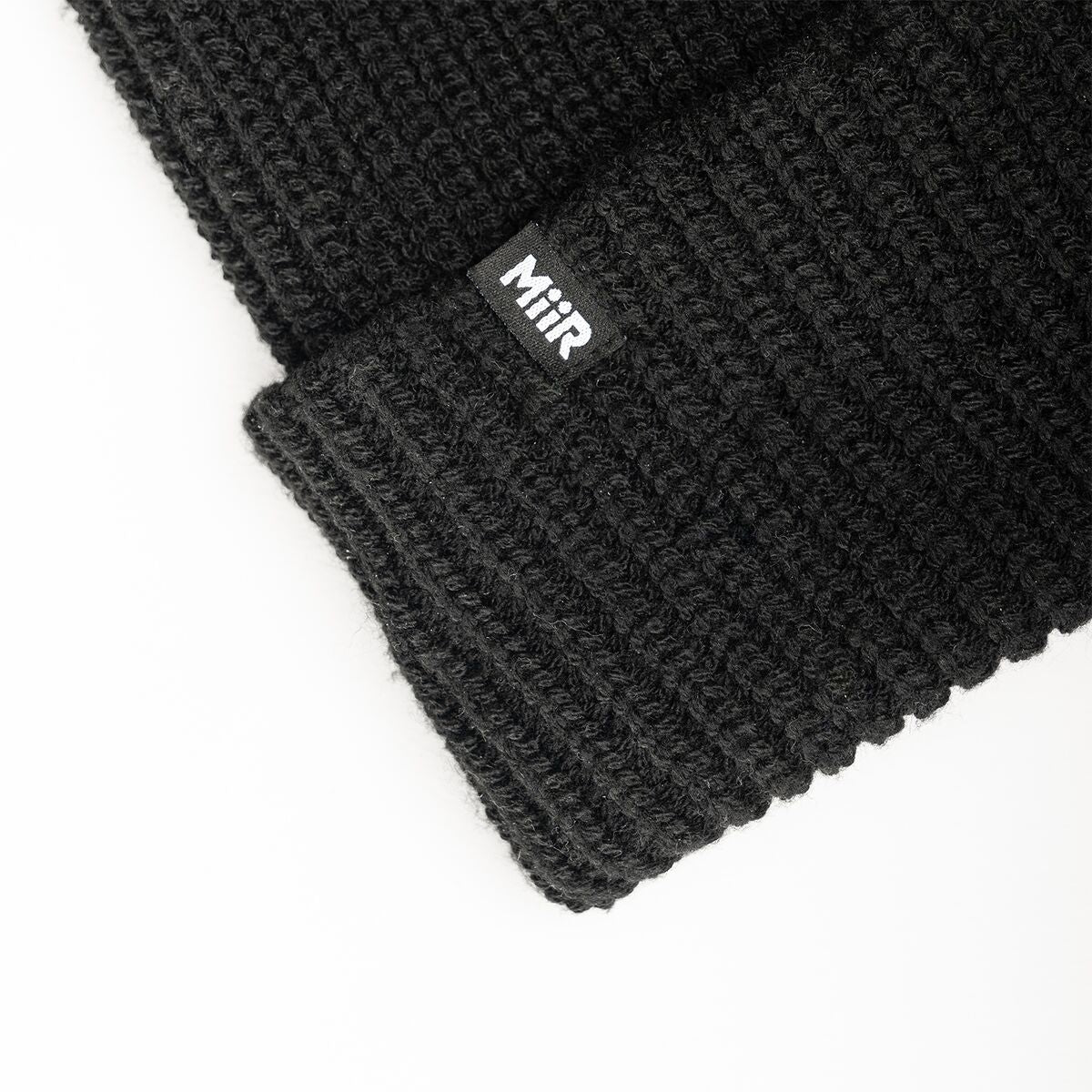 recycled-poly-rib-beanie-c4 WebPDP-RecycledPolyRibBeanie_Studio_TagDetail_Black__BNE002002OS.jpg